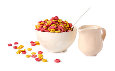 Bowl with tasty cereals and jug of milk on white background