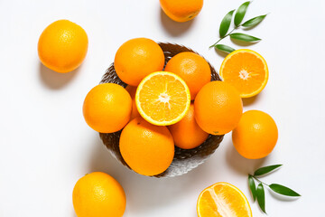 Bowl with oranges on white background