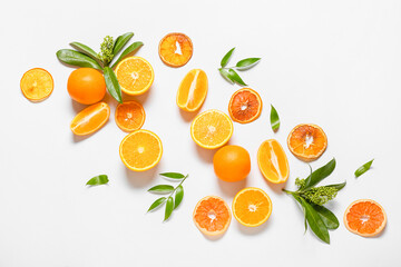 Ripe tasty oranges on white background