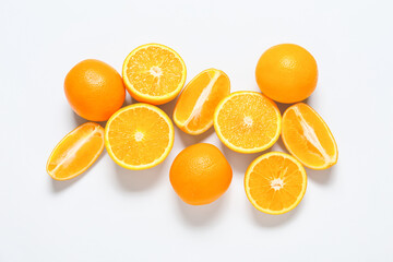 Fresh cut oranges on white background