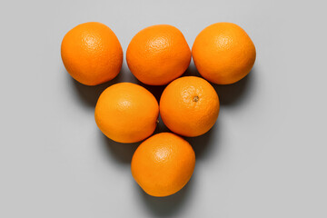 Tasty oranges on light background