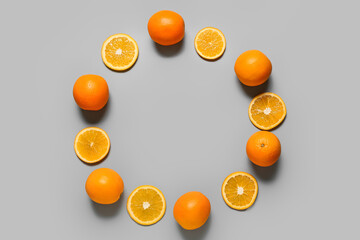 Frame made of oranges on light background