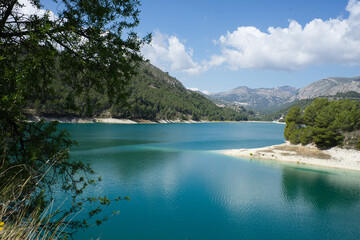 An idyllic lake between mountains.Guadalest reservoir in Alicante, Spain.