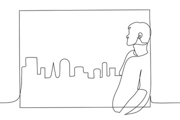 man looks out the window at the city. a man in a T-shirt is leaning against the windowsill, he is looking at the city from a large window - one line drawing. concept of hotel room view from the window