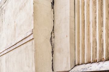 Huge crack on the corner of building with metallic plaster mesh. Grid. House. Problem. Issue....