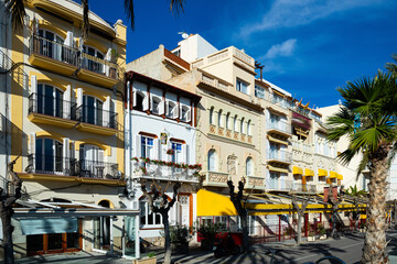 Fototapeta na wymiar Walking street with cafes and shops. SITGES, CATALONIA, SPAIN - November 18, 2020