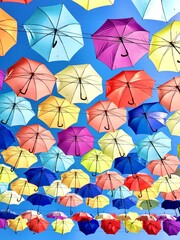 Fototapeta na wymiar Many umbrellas against the blue sky.