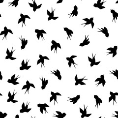 Seamless pattern with black swallow silhouette on white background. Cute bird in flight. Vector illustration. Doodle style. Design for invitation, poster, card, fabric, textile