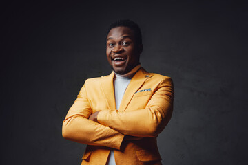African descent businessperson dressed in yellow coat