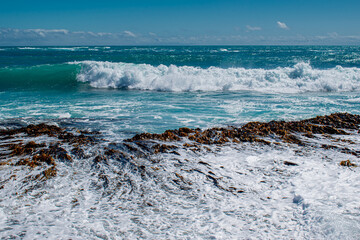 Scenic view of ocean waves hitting the shore