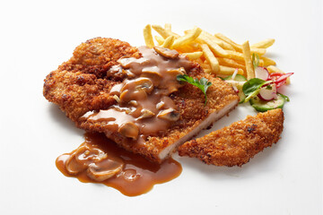 Veal schnitzel with champignon sauce and French fries