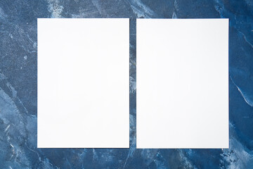 Blank sheets of paper on color background