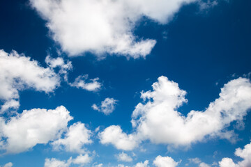 Fototapeta na wymiar Blue sky background with clouds in summer 