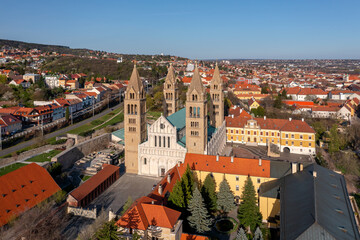 Fototapeta na wymiar Amazing aerial cityscape about the Pecs city historical downtown and basilica in springtime. Unique medieval mood city in Hungary
