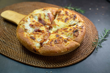 Delicious fresh pizza served on wooden plate, Hot Homemade Pizza Ready to serve.