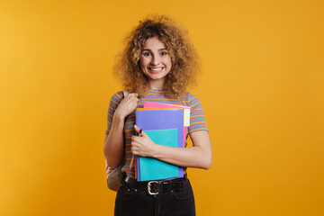 Happy young woman student with backpack