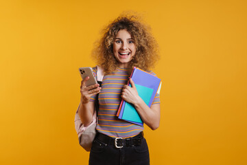 Happy young woman student with backpack