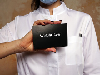  Weight Loss sign on the piece of paper.