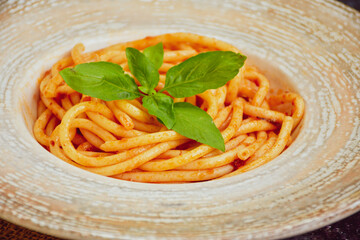 Spaghetti  bolognese .Italian home made meal Fresh  bucatini pasta with tomato sauce, basil, herbs ,parmesan cheese ,fresh cherry tomatoes and parsley on wooden background. Kitchen Poster 
