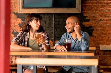 A young couple having fun in a bar