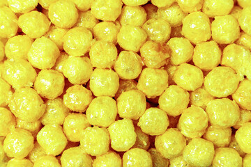 Sweet corn balls covered with syrup