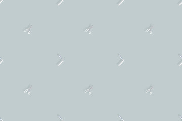 Seamless pattern on the theme of the barber shop. Background from a straight razor and hairdressing scissors. 