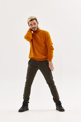 Fototapeta premium man brown sweater autumn style Studio fashion full length