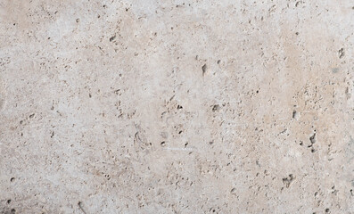 beige concrete wall background with texture and scuffs