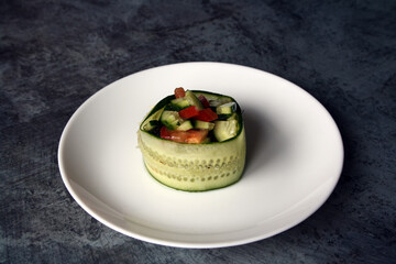 Salad of tomatoes, cucumbers and dill with olive oil on a white plate. Vegetarianism. Lean food.