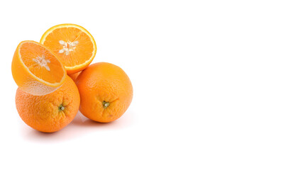 juicy orange fruits are whole and cut in half, isolated on a white background.