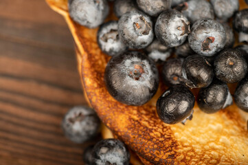 Fresh blueberries and traditional Russian pancakes. Shrovetide week of the end of winter.