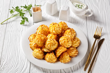 Duchess potatoes served on a white plate