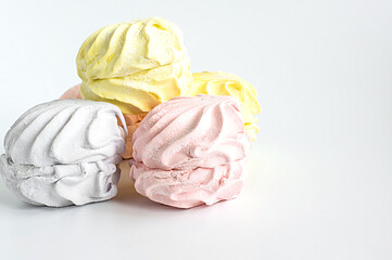 Marshmallows, zephyr - confectionery and sweets isolated on a gray background . Template, layout, blank. Selective focus.