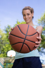 female basketball player holding ball