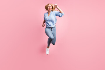 Full size photo of young happy positive good mood girl running fast in air wear blue cardigan...