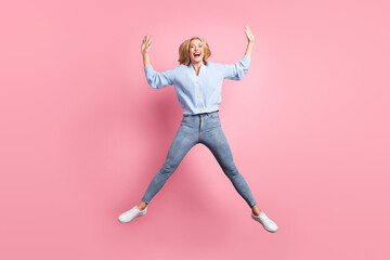 Fototapeta na wymiar Full size photo of young funky funny smiling positive cheerful girl jumping laughing isolated on pink color background