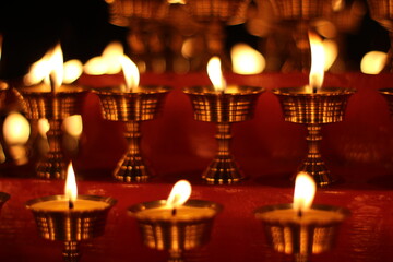 Buddhist Altar Candles at Religious 108 Butter Lamp Festival in Temple Monastery. Beautiful Tranquil Scenic View of Oil Lamps and Swaying Flame for Praying