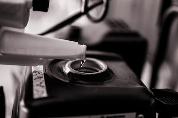 adding winter stabilizer fuel additive to a snow blower gas tank