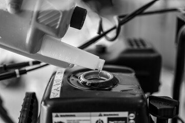 adding winter stabilizer fuel additive to a snow blower gas tank