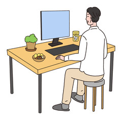 デスクでお酒を飲みながらパソコン作業をしている男性