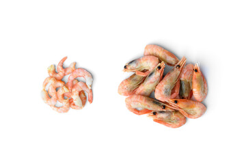 Peeled and unpeeled shrimps isolated on white background. Top view.