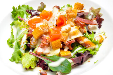 Caesar salad with chicken, bacon, tomato and homemade sauce
