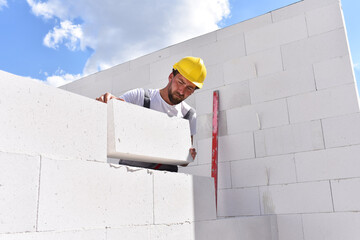 profession construction worker - work on a building site construction of a residential house