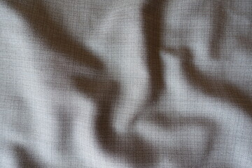 Grey fabric with dupplins checks in soft folds