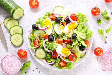 vegetable salad with egg,  cucumber and tomato