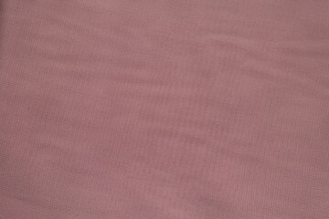 Surface of simple thin pink chiffon fabric from above