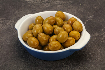 Green pickled olives in the bowl