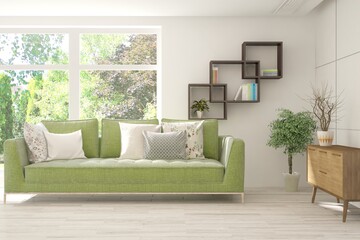 White living room with sofa and summer landscape in window. Scandinavian interior design. 3D illustration
