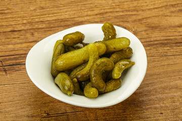 Pickled gherkin in the bowl