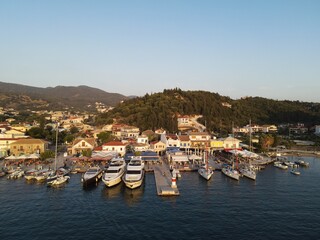 Fototapeta na wymiar Aerial view of yachts, marina and seafront of famous sivota town in epirus, greece